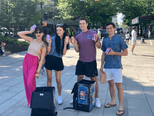 people posing with their beer cans and granville ice chest